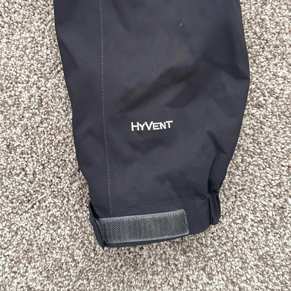 The North Face Black Hooded Raincoat with Multiple Front Pockets